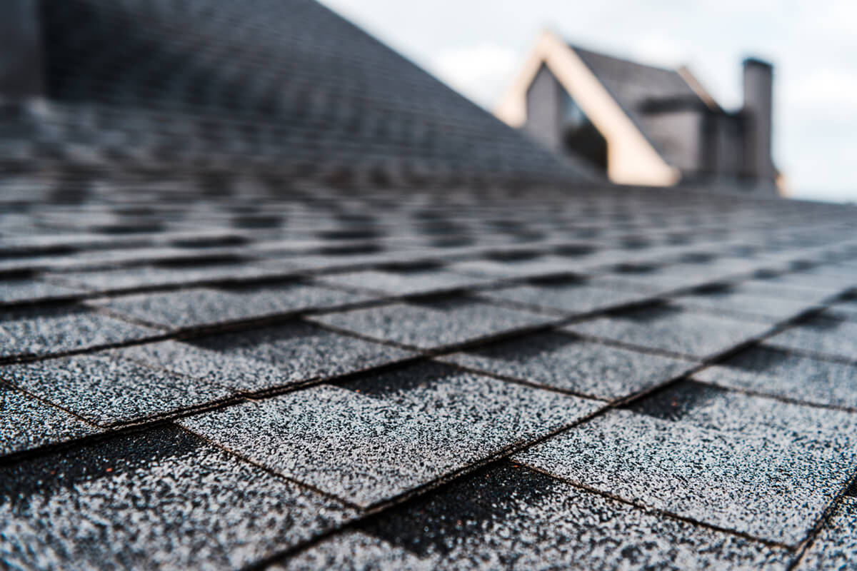 Closeup photo of a shingled roof.