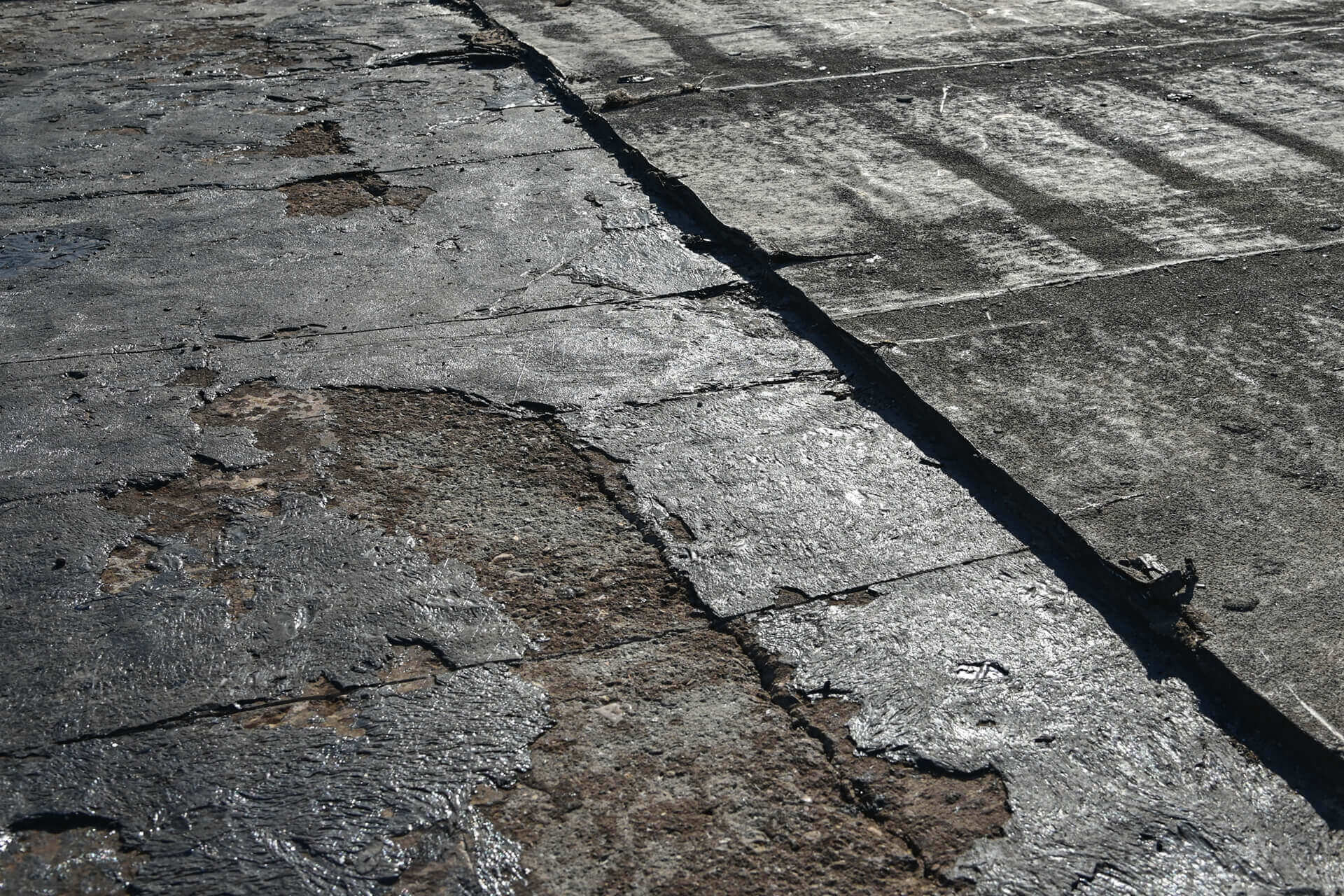 Damaged bitumen flat roof.